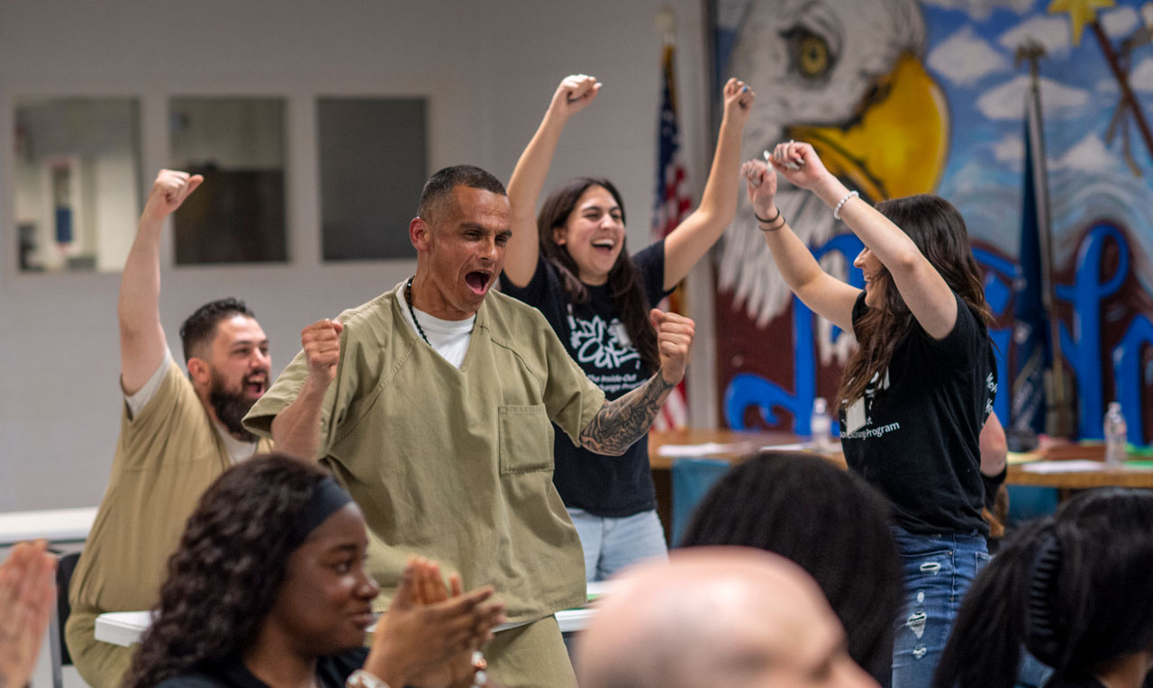 Participants in the UNT Inside Out Program - both incarcerated and UNT students - looking really happy while interacting at the Bridgeport Correctional Facility.