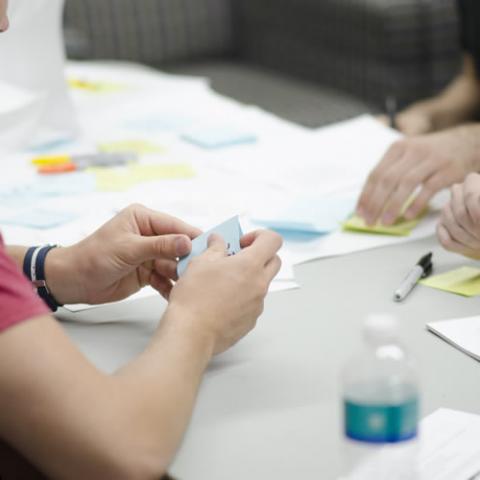 Volunteers working on a project at a table