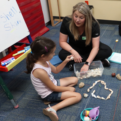 SLP student working with a child