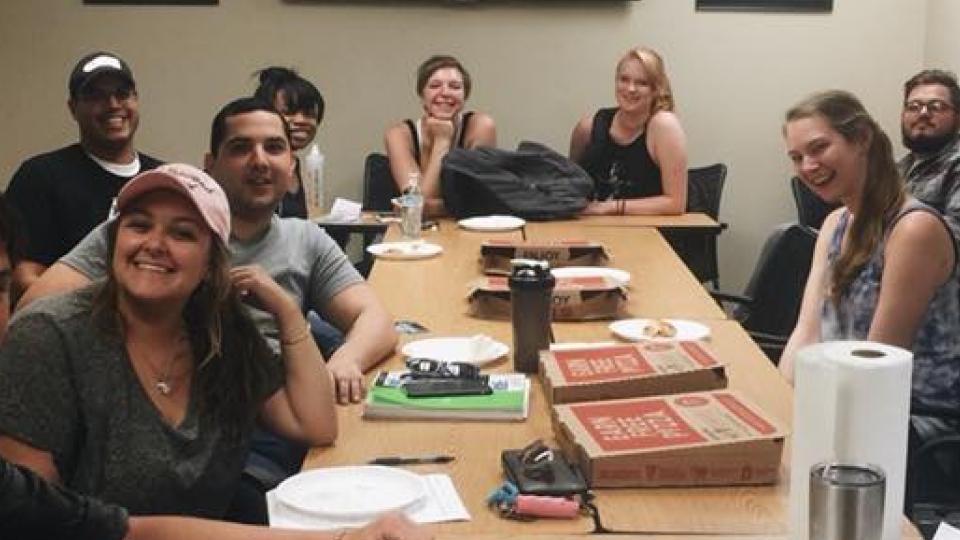 Eagle Peer Recovery members sitting at table