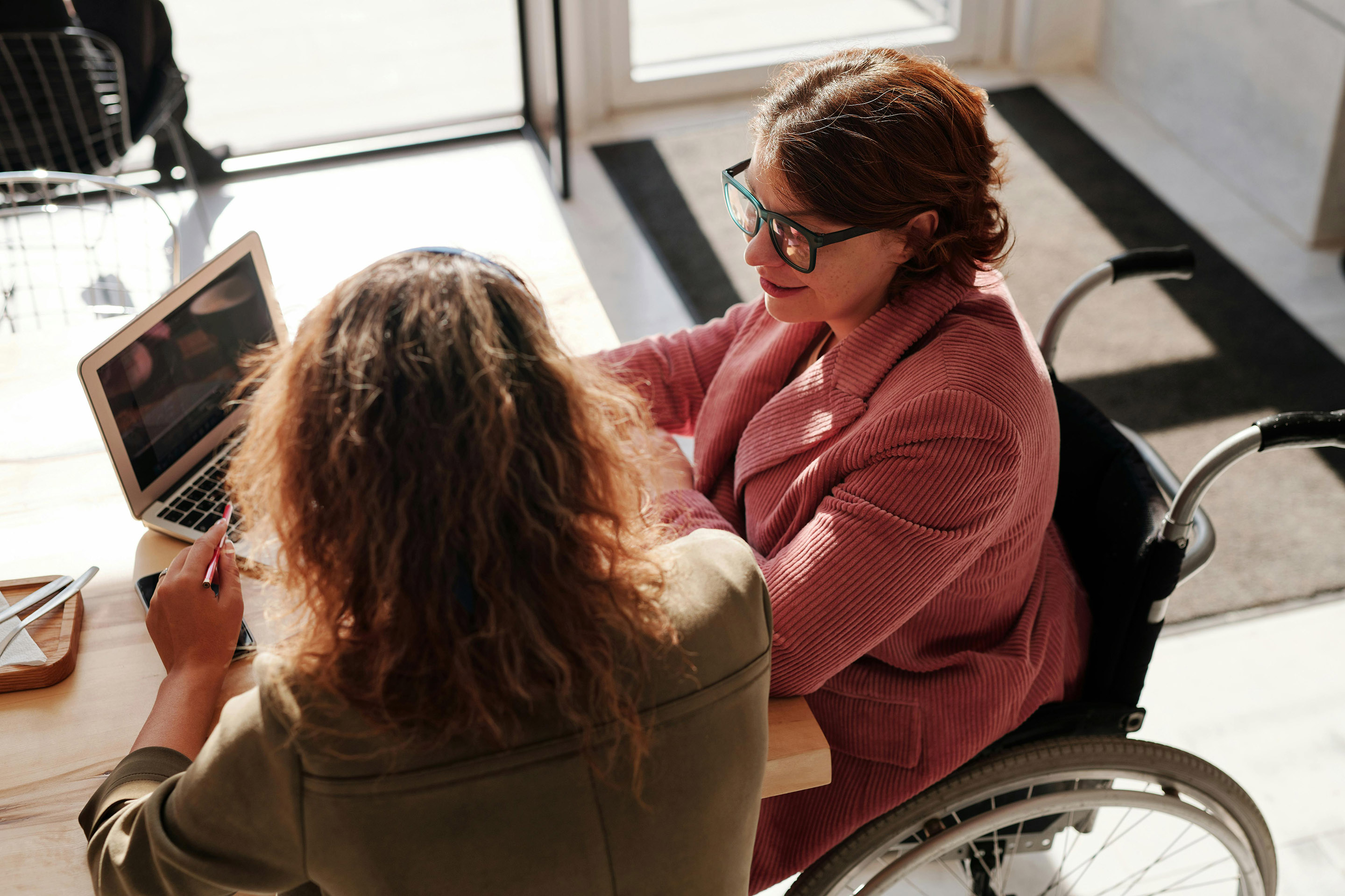 Woman in wheelchair receiving counseling services